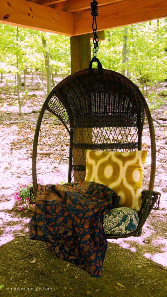 Swinging chair under treehouse