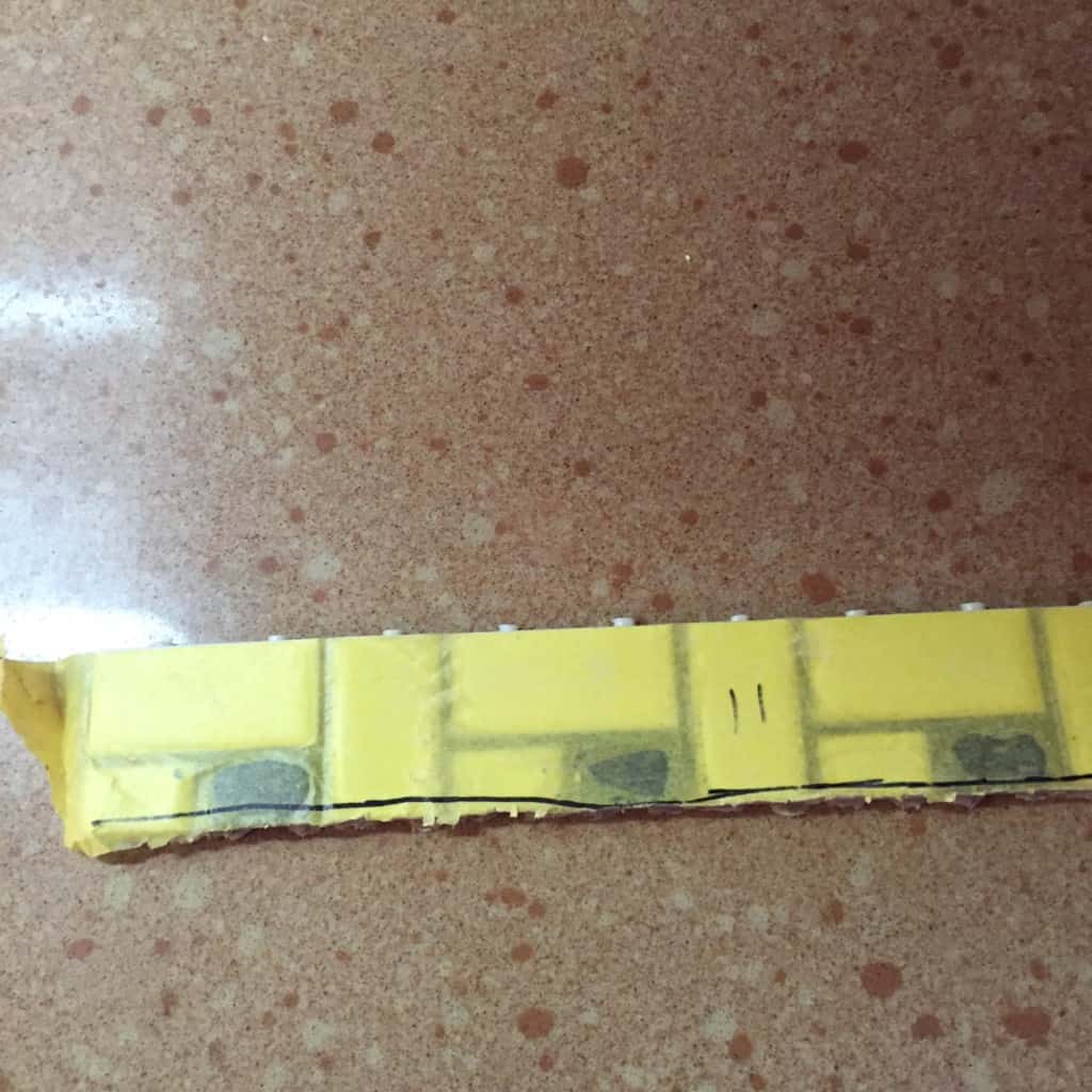 tape on tile sheets while cutting