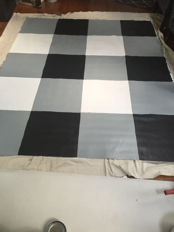 painting a buffalo check pattern on a vinyl floor mat