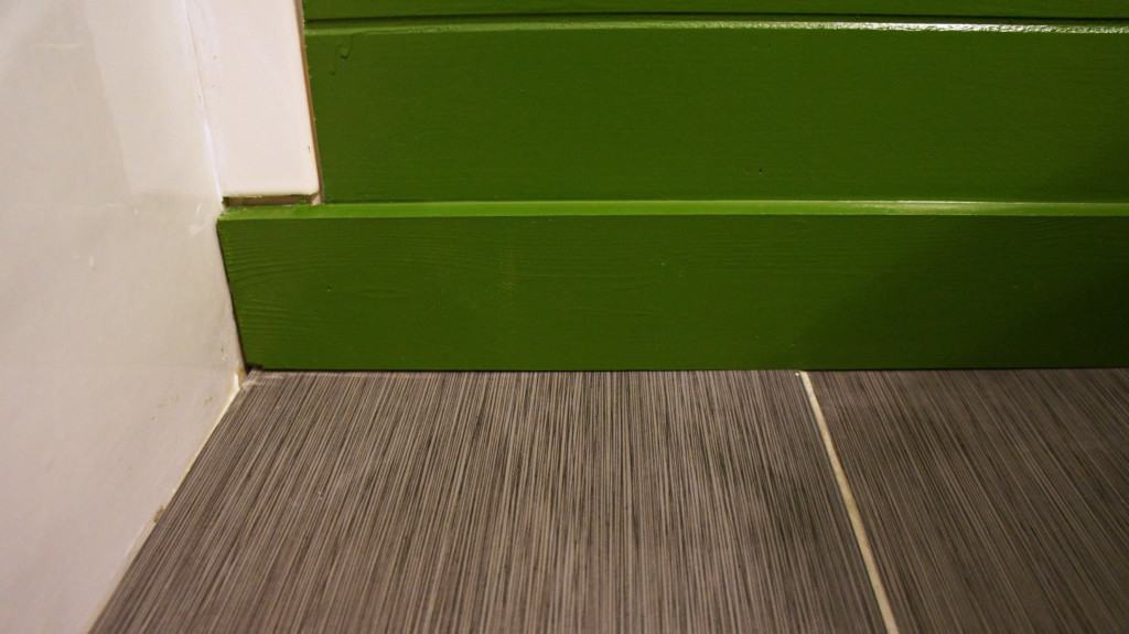 tile floor and green shiplap