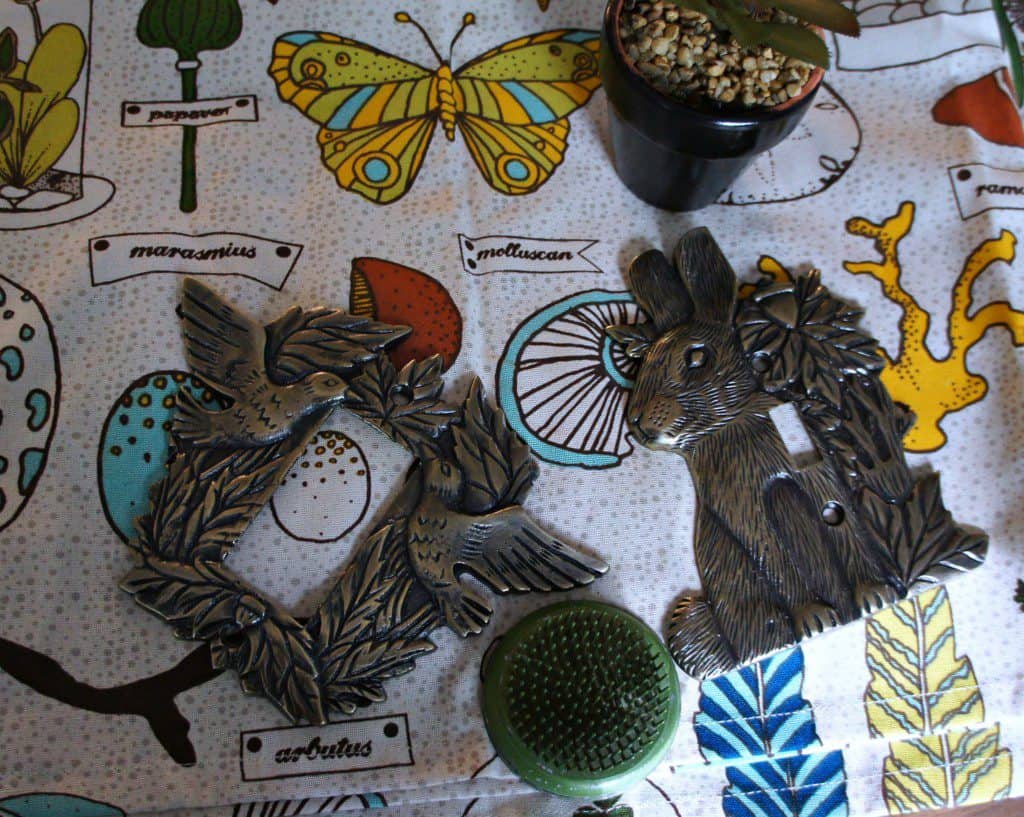 brass light switch covers and cute shower curtain with bugs
