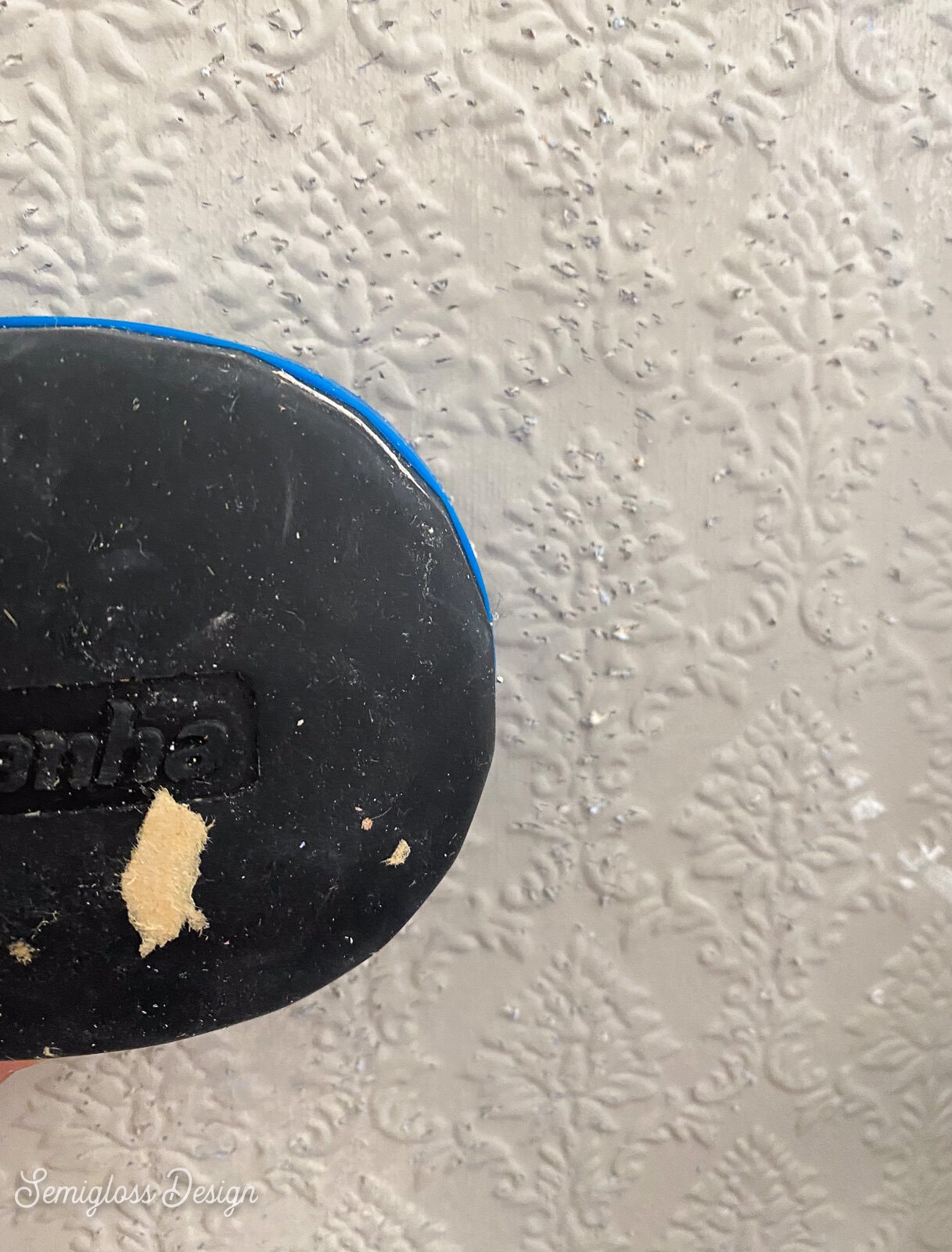 using a paper scorer on wallpaper for removal