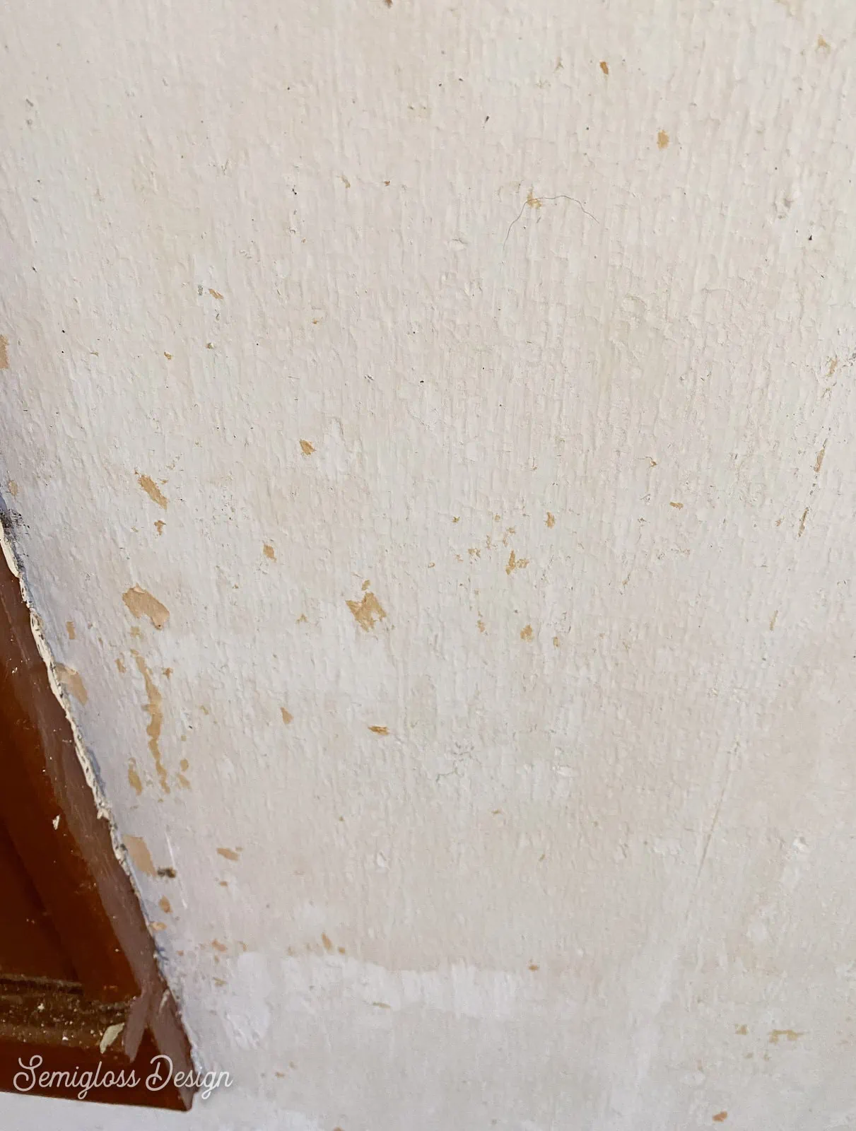 spots of wallpaper on wall