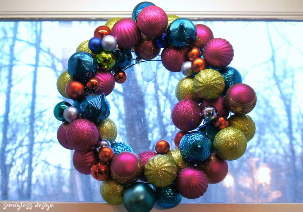 colorful ornament wreath hanging on window