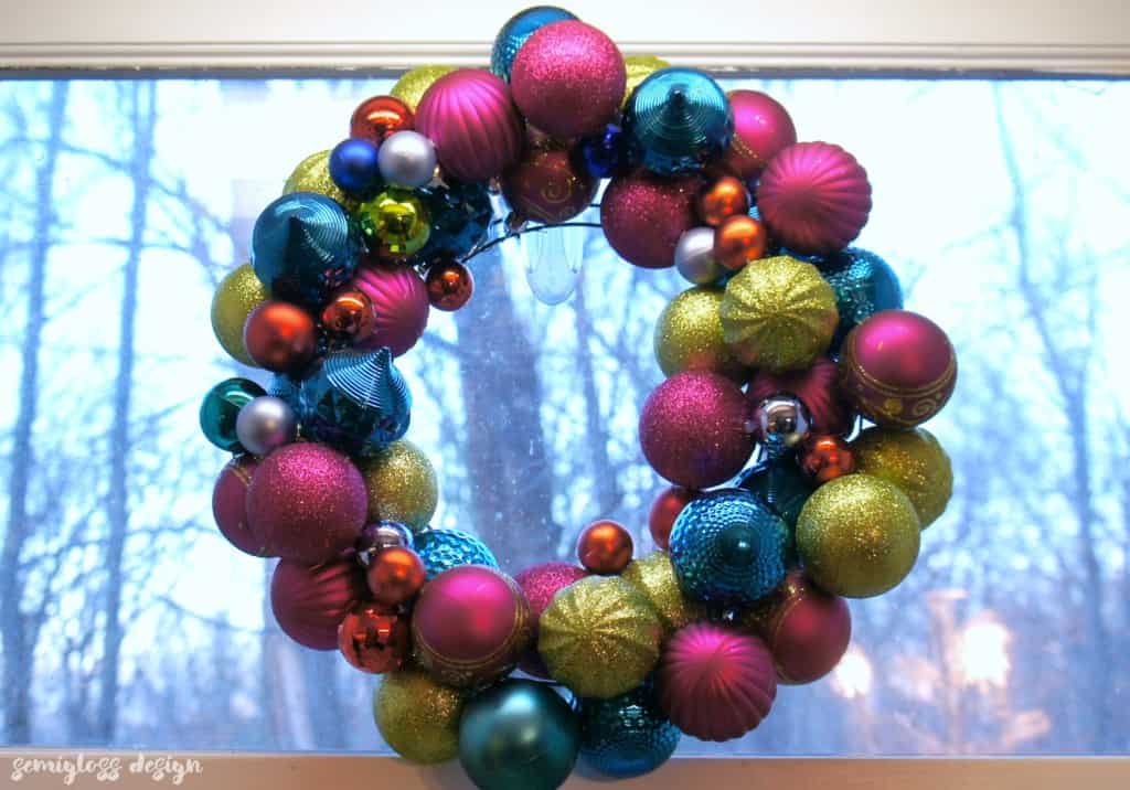 A DIY ornament wreath is a fun way to add color to your holiday decor. Make one today! #christmasdecor #christmasdecorations #christmaswreaths #ornamentwreath