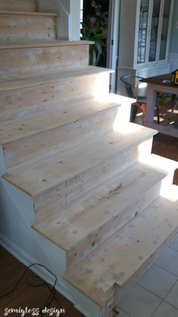 filled staple holes and baluster holes to get stairs ready for stain