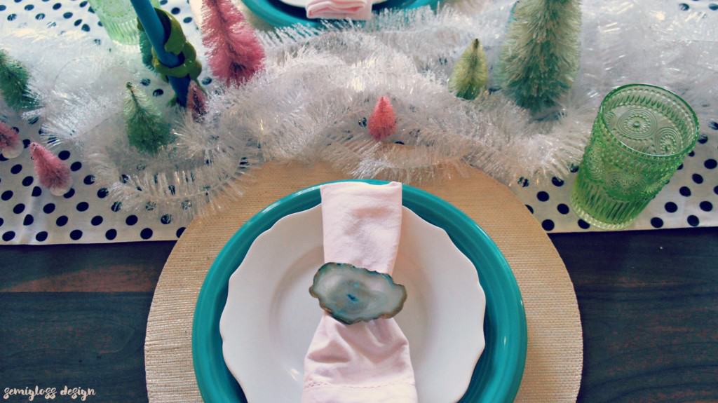 Dyed bottle brush trees, tinsel and agate combine to make a dazzling winter tablescape. 