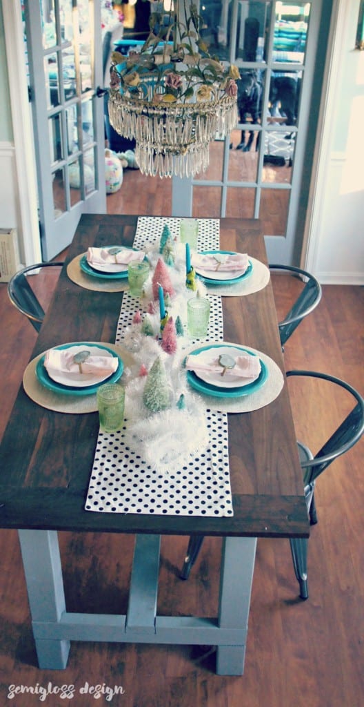 Bottle brush trees, agate and tinsel make a magical winter tablescape. 