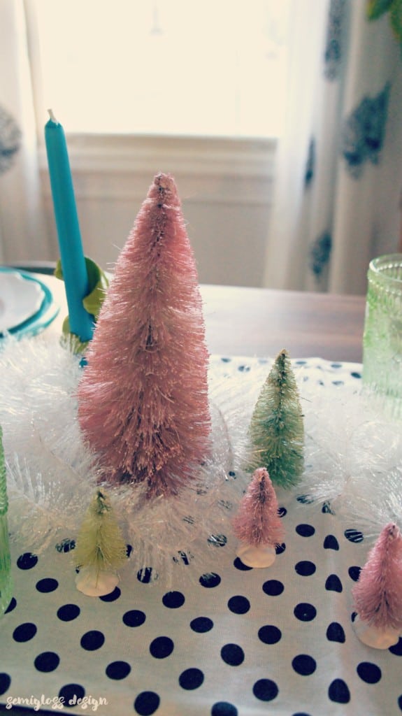 Bottle brush trees, agate and tinsel make a magical winter tablescape. 