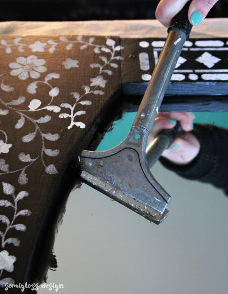 Learn how to use an Indian inlay stencil for a mirror makeover! This easy DIY makeover is a great way to add a boho touch to your home!