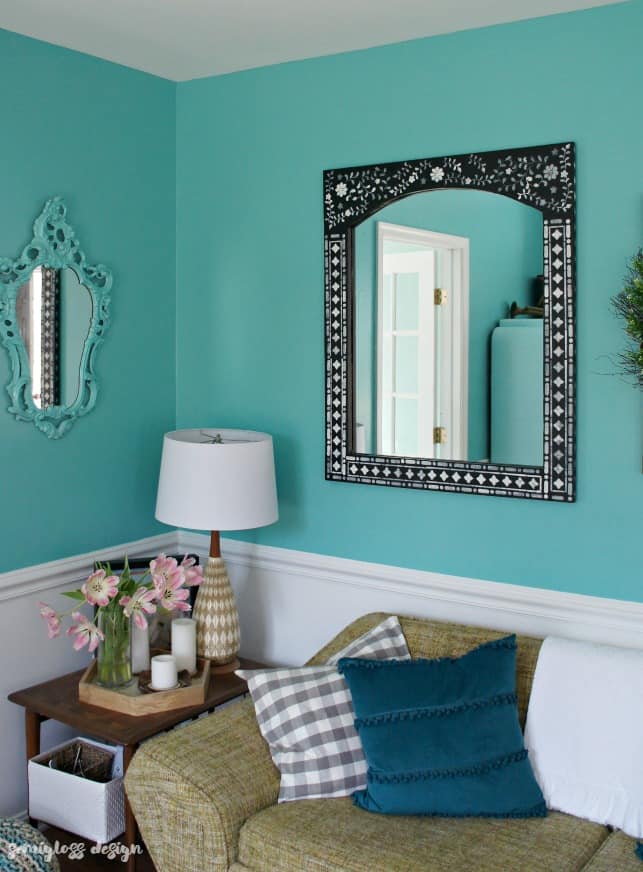 Learn how to use an Indian inlay stencil for a mirror makeover! This easy DIY makeover is a great way to add a boho touch to your home!