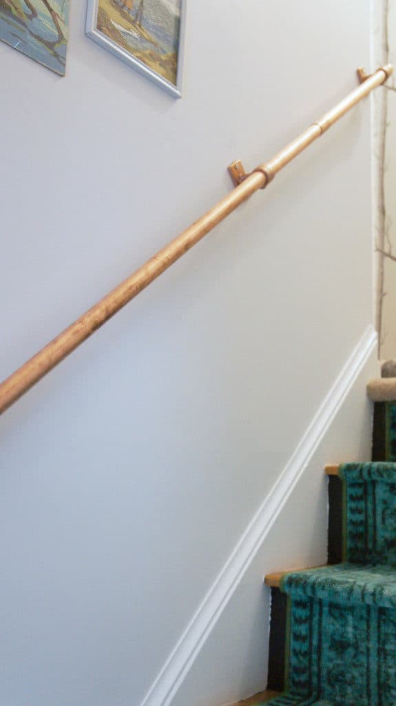 copper pipe in stairway