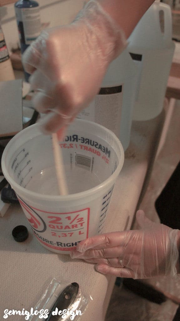 mixing epoxy in bucket