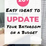 bathroom with blue vanity and striped shower curtain