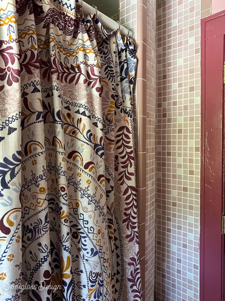 mandala shower curtain with pink mosaic tile and red trim