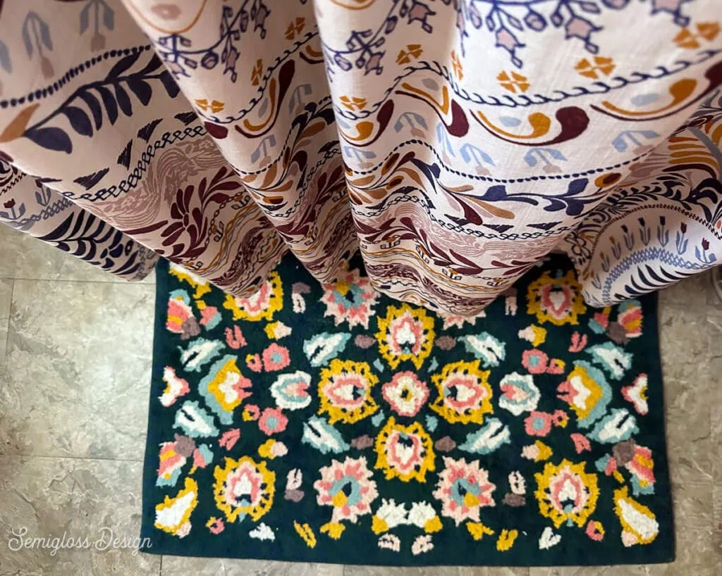 mandala shower curtain and floral rug in bathroom