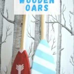 painted oars against tree wallpaper