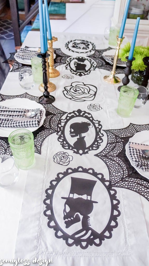 skull table runner and glasses for Halloween tablescape