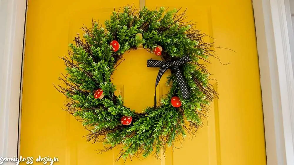 This DIY wreath ideas is as adorable as it is easy to make! Add a woodland touch to your door with this cute mushroom wreath.