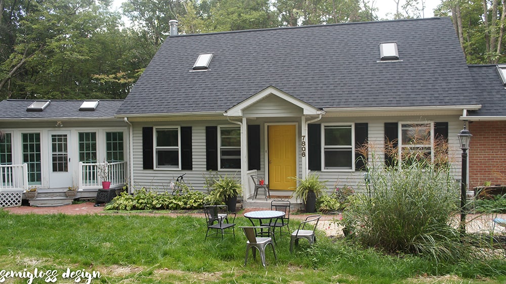 Whole house update with painted vinyl shutters and painted front door.