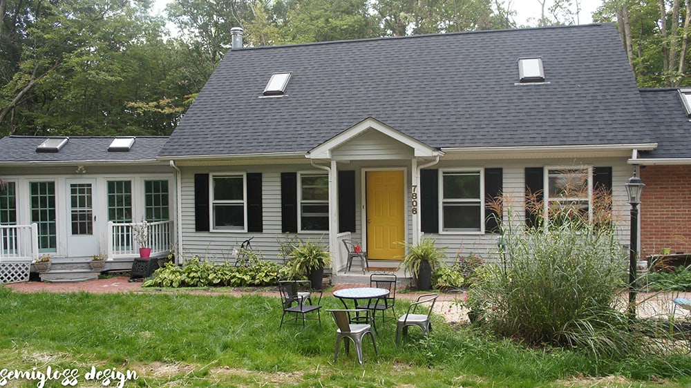 Whole house update with painted vinyl shutters and painted front door. 