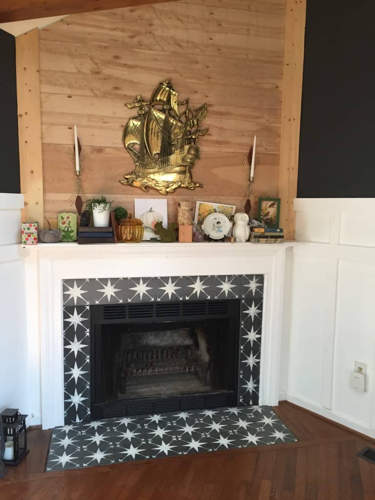 Stenciled fireplace surround with shiplap 