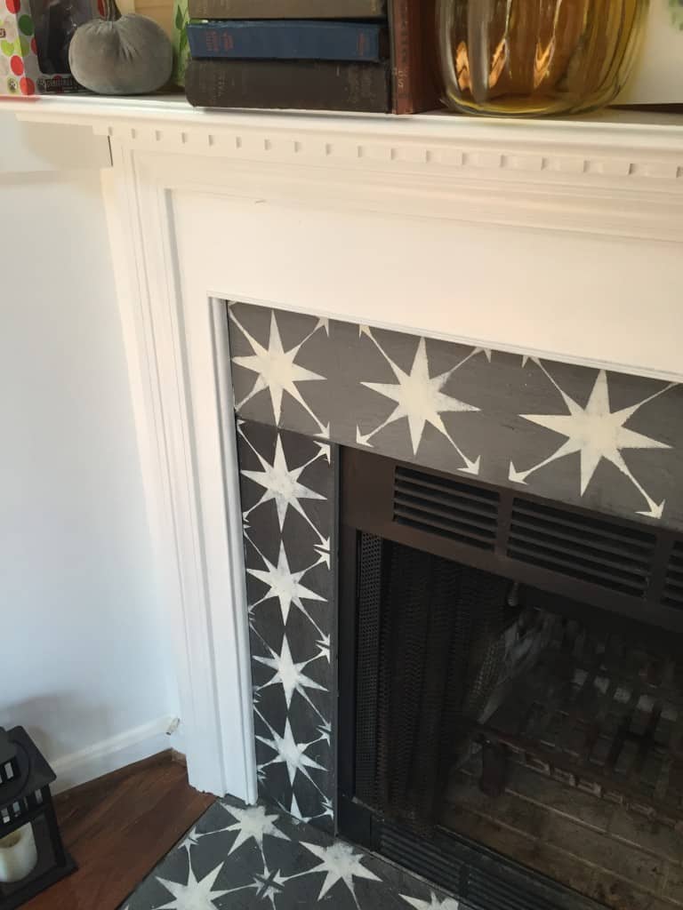 Star stencil on fireplace tile surround