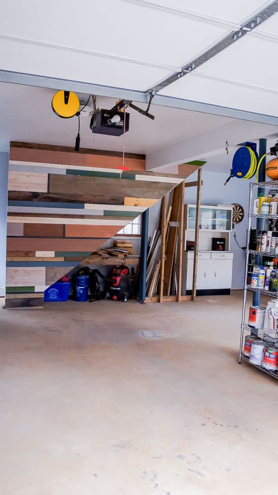 vintage inspired garage with scrap wood wall