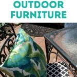 wrought iron patio chair with tropical leaf pillow
