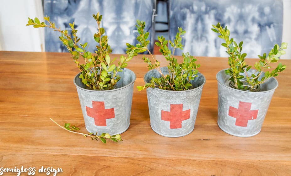 three galvanized buckets