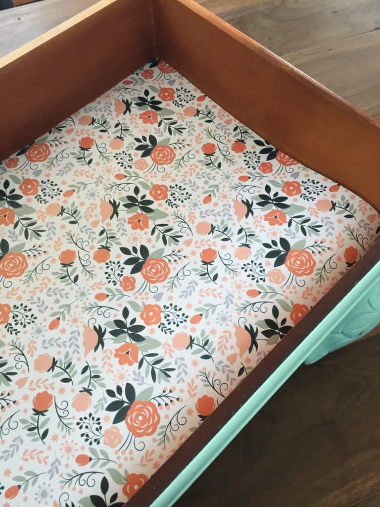 How to add DIY drawer liners to your furniture makeovers using wrapping paper. #furnituremakeover #paintedfurniture #prettypaper