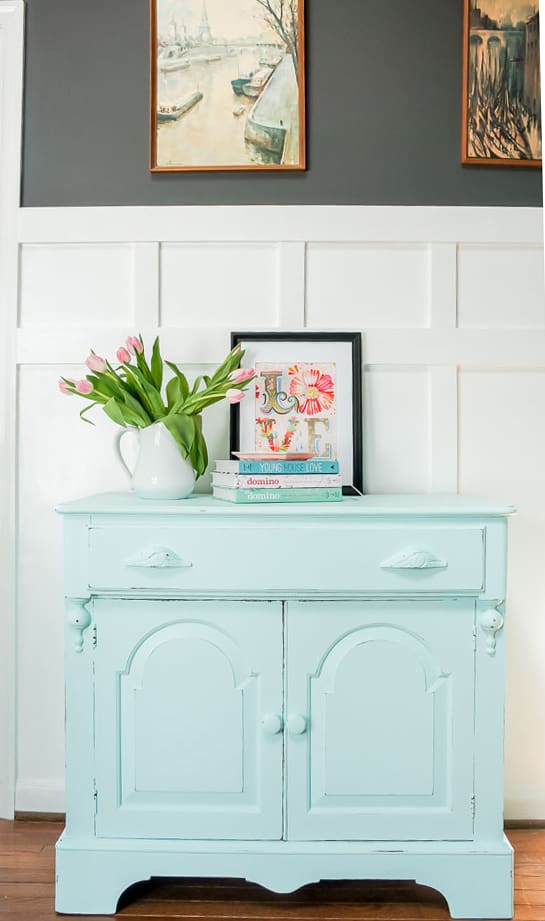 A spring furniture makeover featuring a pastel aqua paint on a credenza. This piece went from stuffy to gorgeous! #painted furniture #fusionmineralpaint #springdecor