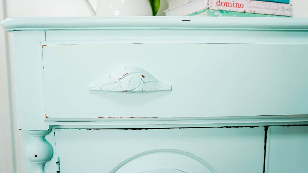 A spring furniture makeover featuring a pastel aqua paint on a credenza. This piece went from stuffy to gorgeous! #painted furniture #fusionmineralpaint #springdecor