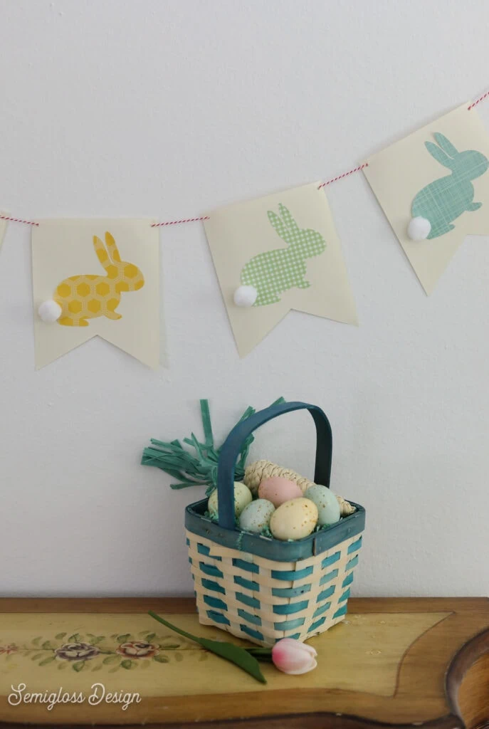 bunny banner with Easter basket on table