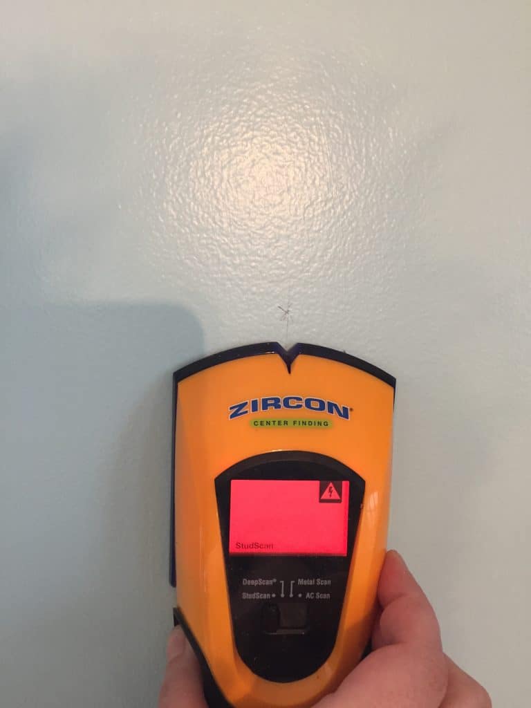 using stud finder to hang shelves