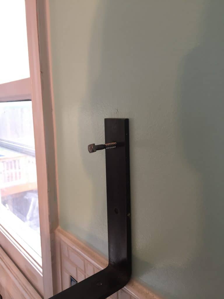 install bolts into studs to hold shelf brackets