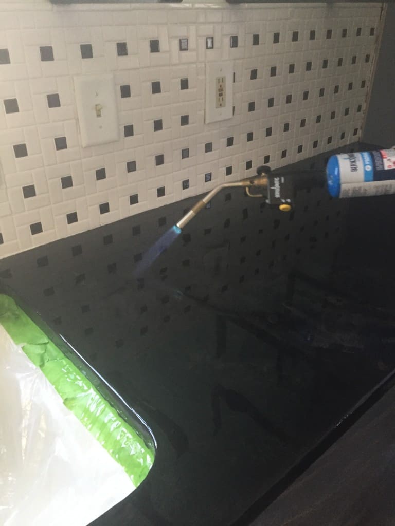 Get rid of bubbles in epoxy countertop sealer with a blowtorch 