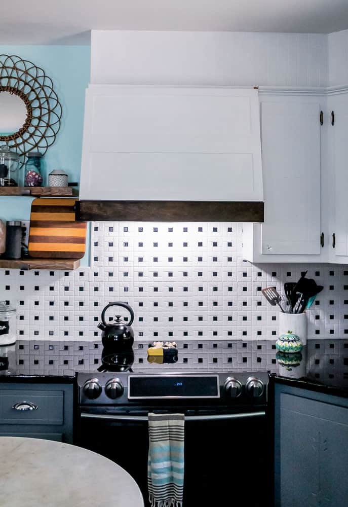 This colorful kitchen makeover on a budget is heavy on DIY and light on the wallet. A few simple changes go a long way in updating an old kitchen. #DIYhome #kitchenmakeover #budgetmakeover