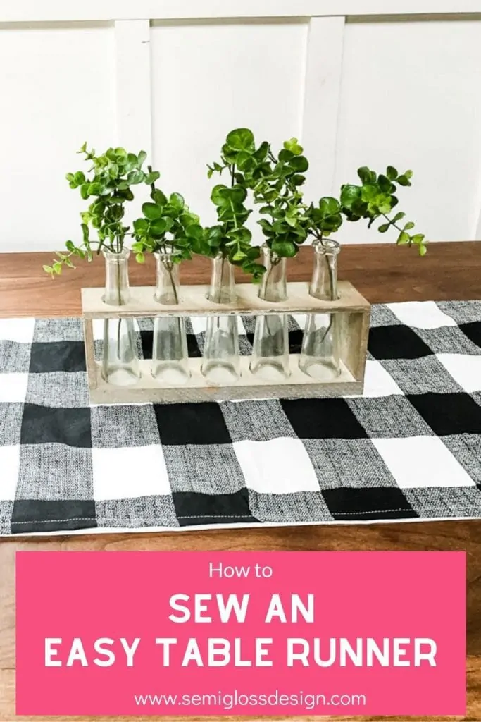 pin image - black and white table runner on wood table with text overlay "How to Sew an Easy Table Runner"