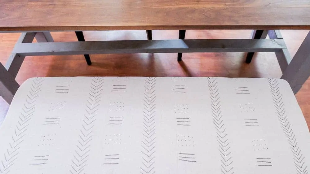 Learn how to make your own DIY mud cloth from drop cloths. This easy DIY is inexpensive and easy to do, even if you're not artistic!
