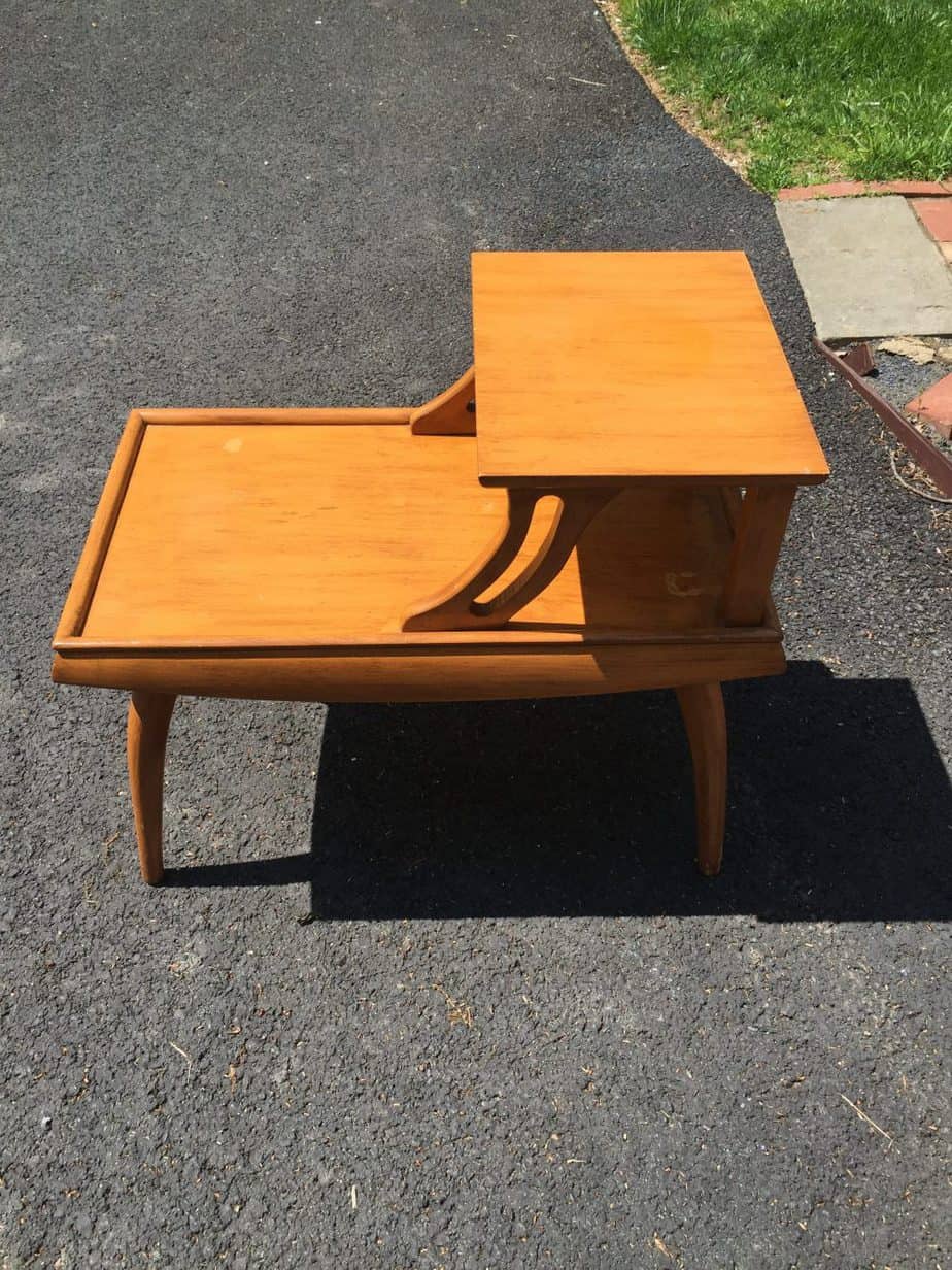 These mid century side tables had a dated finish, but that's easy to fix with paint! Check out this mid century side table makeover painted in a gorgeous black!