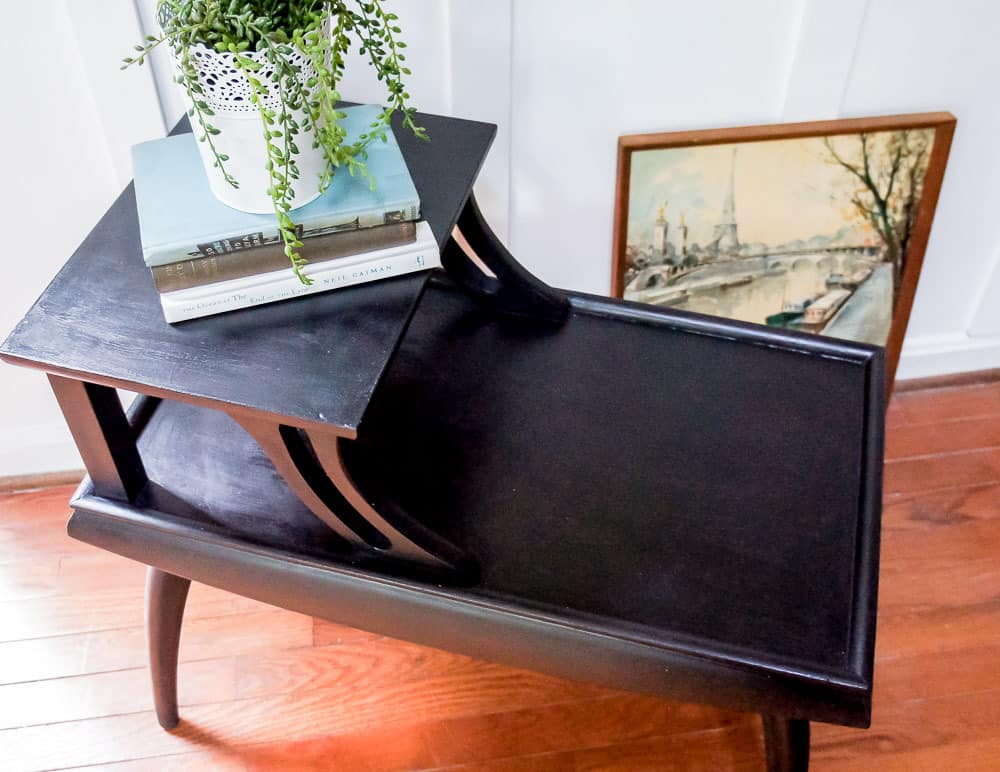 These mid century side tables had a dated finish, but that's easy to fix with paint! Check out this mid century side table makeover painted in a gorgeous black!