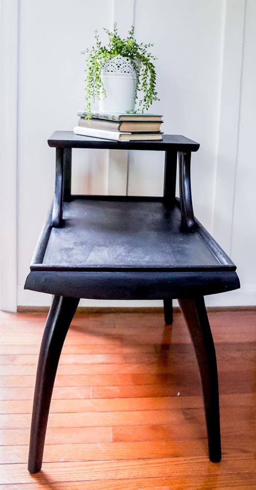 These mid century side tables had a dated finish, but that's easy to fix with paint! Check out this mid century side table makeover painted in a gorgeous black!