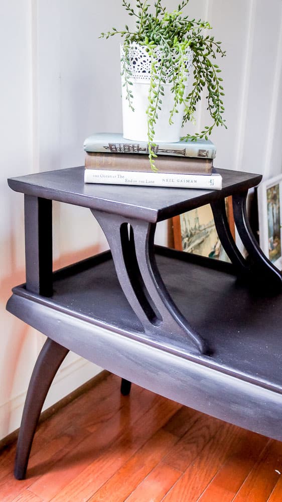 These mid century side tables had a dated finish, but that's easy to fix with paint! Check out this mid century side table makeover painted in a gorgeous black!