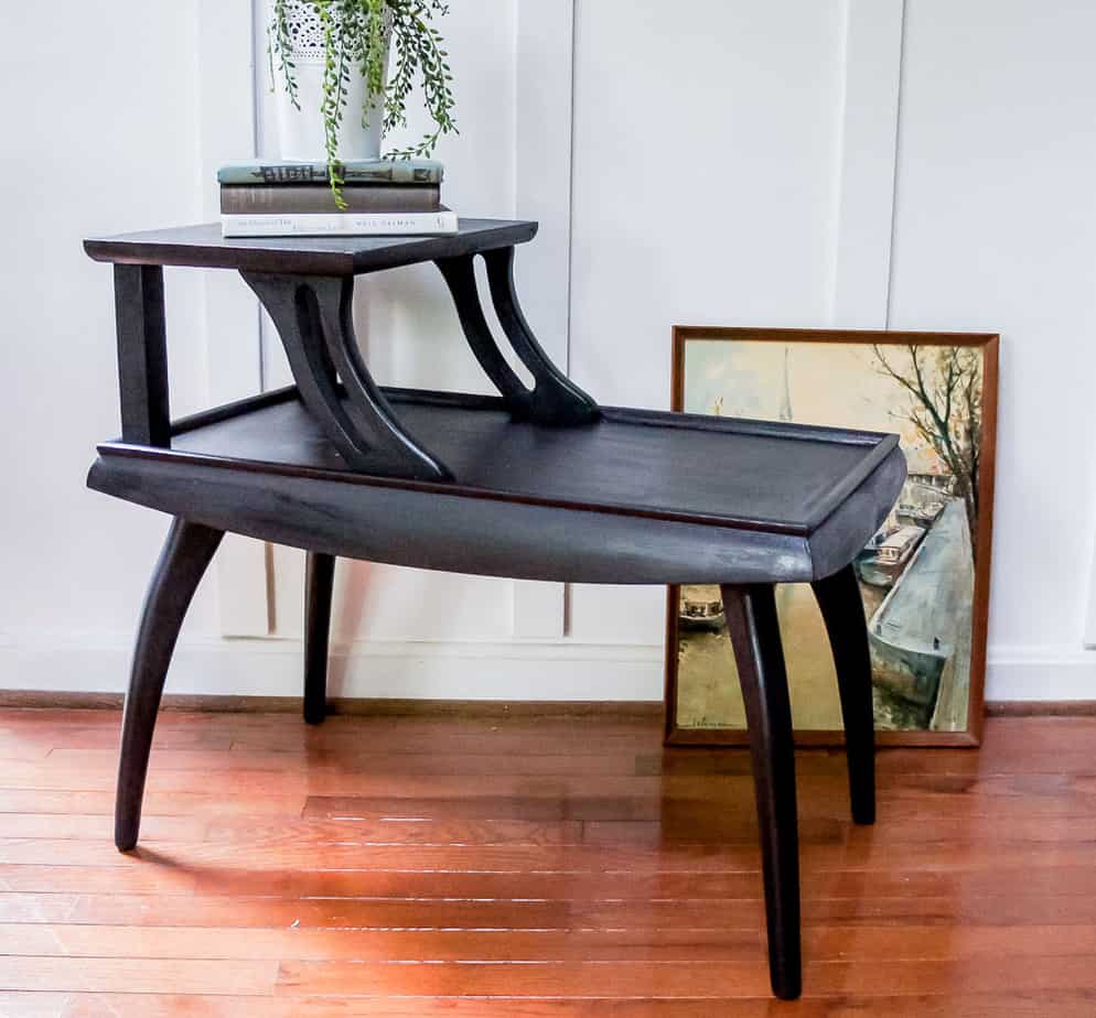 These mid century side tables had a dated finish, but that's easy to fix with paint! Check out this mid century side table makeover painted in a gorgeous black!