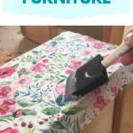 brush adding glue over floral paper napkin on dresser drawer