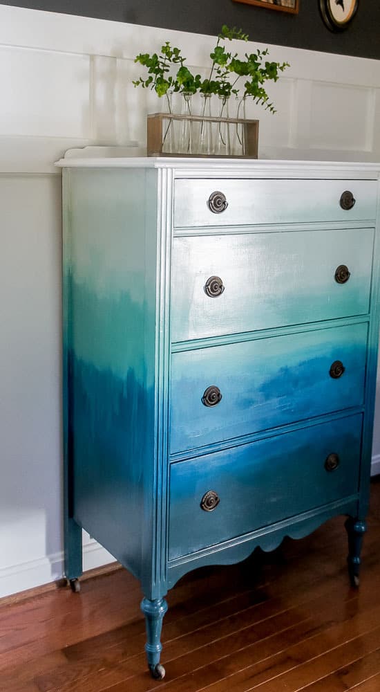 Want to bring a beachy boho look into your home? Create a blended ombre dresser with this fun painting technique. This furniture makeover is easier than you think!