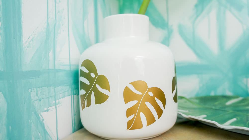 Make an easy summer vase to fill with all of your favorite summer blooms or foliage! This DIY vase features gold monstera leaves for a fun, tropical feel!