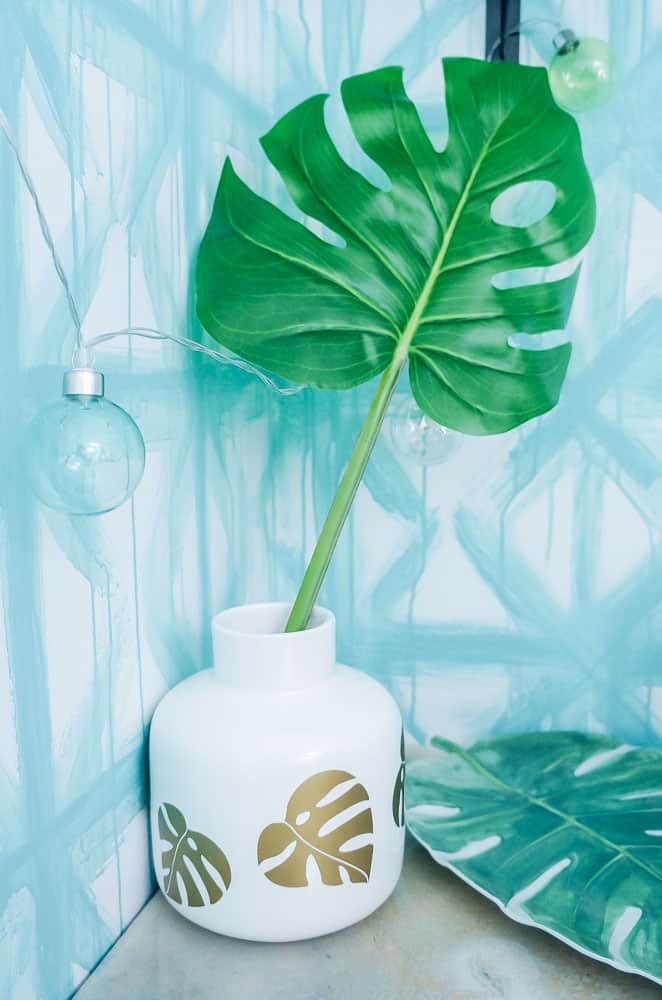 Make an easy summer vase to fill with all of your favorite summer blooms or foliage! This DIY vase features gold monstera leaves for a fun, tropical feel!