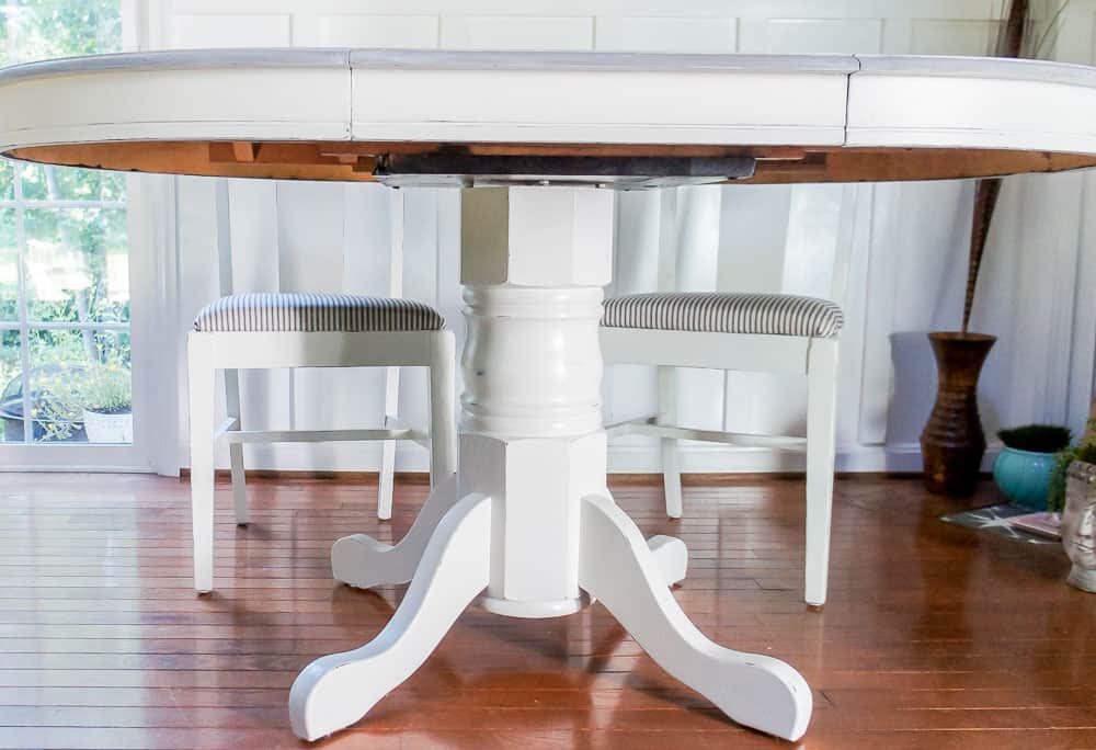 White distressed table base on dining table